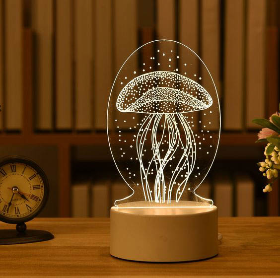 Centro de mesa personalizado fabricados con aclilico marcados en laser y luces led RGB, ideal para resaltar el eventos.