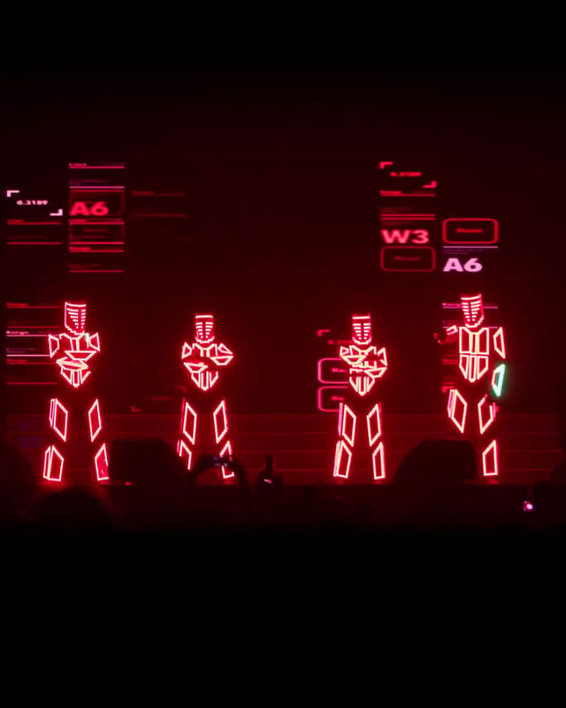 Show de bailarines Lightman con trajes LED rojos